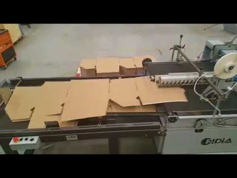 Tear tape and double sided tape application on corrugated carton A/18